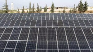 Solar panels installed at a large-scale ground-mounted solar farm site
