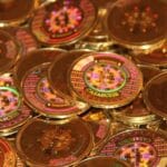 A close-up of a rare physical bitcoin with a tamper-evident hologram