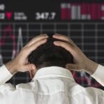 Professional investor analyzing market charts during a period with crypto ending