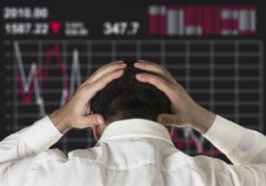 Professional investor analyzing market charts during a period with crypto ending