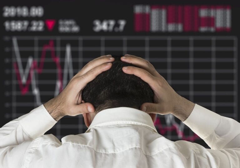 Professional investor analyzing market charts during a period with crypto ending