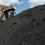 Coal Minister Reddy reviewing official documents regarding the SCCL coal investigation