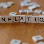 Financial analyst reviewing inflation charts and energy market data