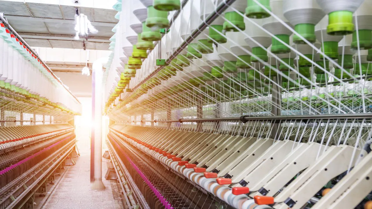 Textile manufacturing machinery in a modern Indian factory setting