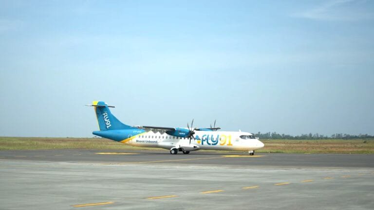 FLY91 aircraft preparing for takeoff at a regional airport terminal