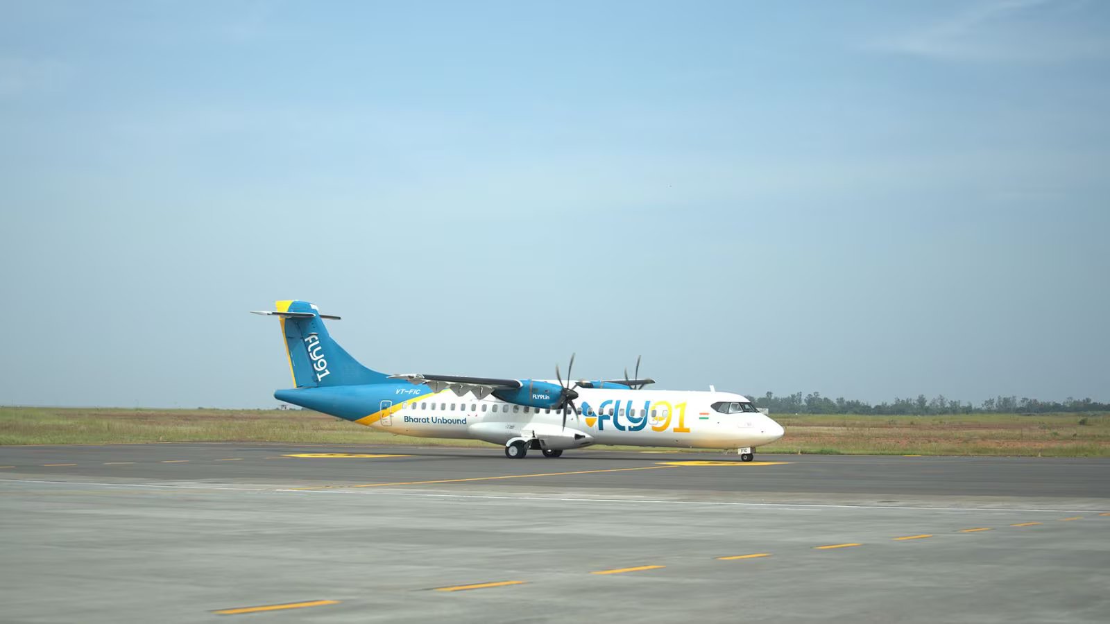 FLY91 aircraft preparing for takeoff at a regional airport terminal