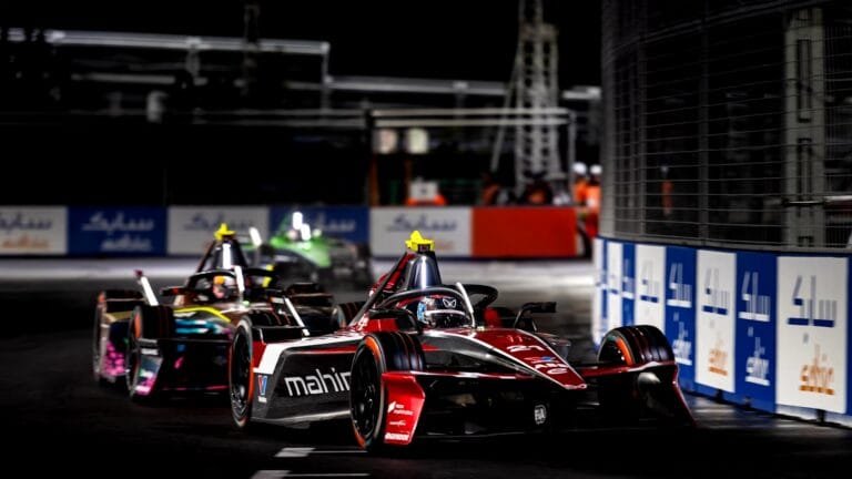 Mahindra Racing car on a Formula E track representing long-term EV innovation