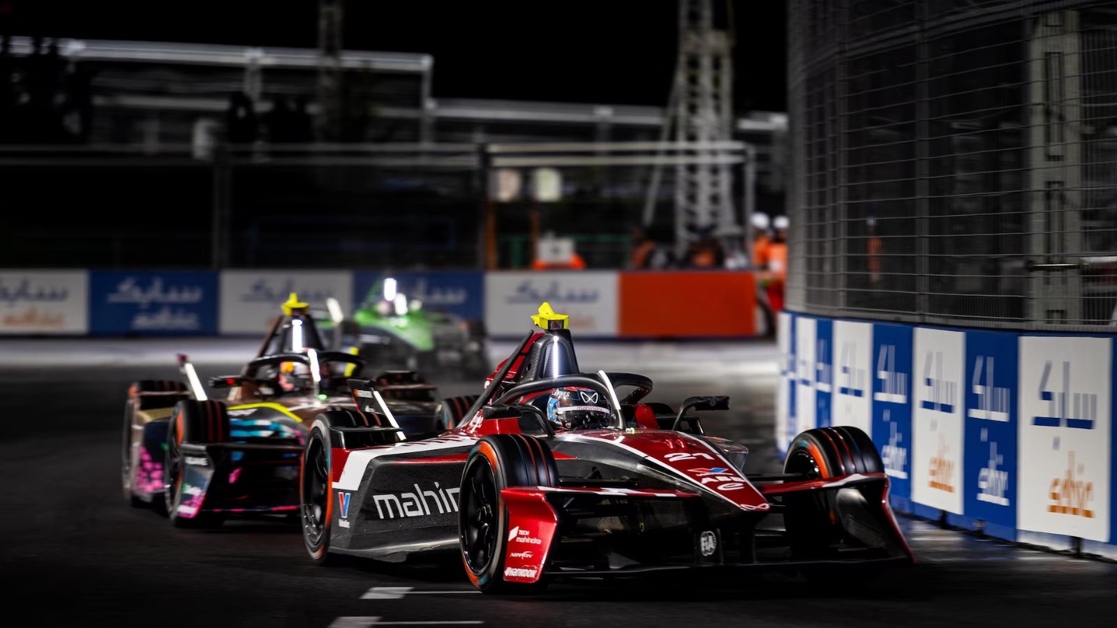 mahindra stays in: The Essential Game-Changing Update 1 Mahindra Racing car on a Formula E track representing long-term EV innovation