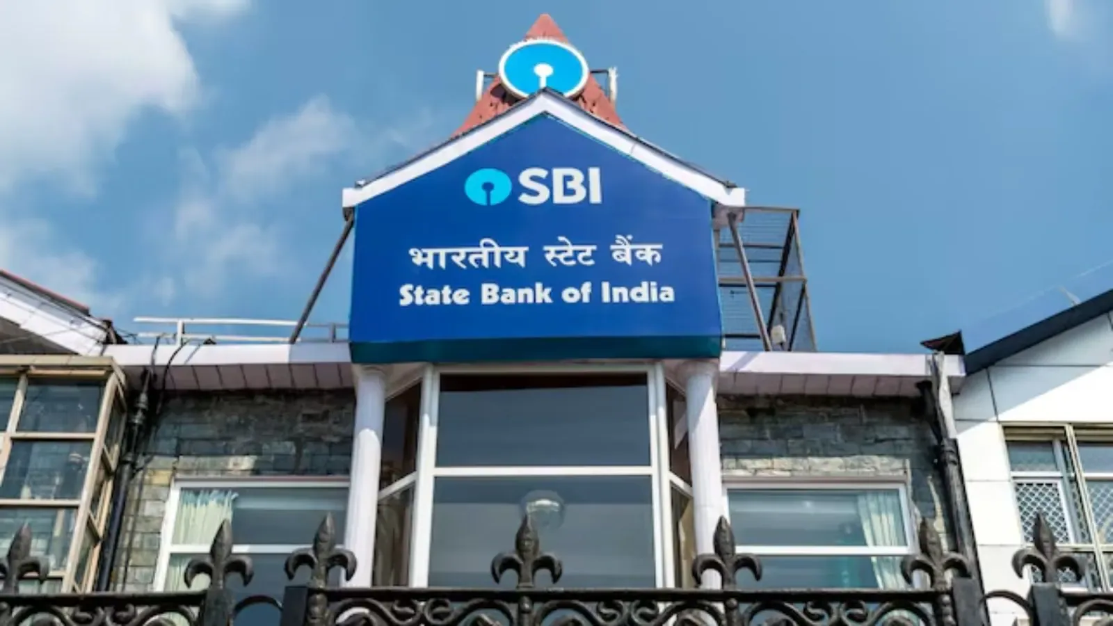 sbi to revise: The Essential Urgent Update for Users 1 A professional banking environment showing a customer using an ATM to manage their savings account.