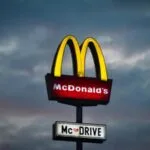 A digital representation of corporate stocks and blockchain technology representing why mcdonalds, microsoft are cautious.