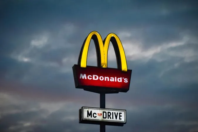 A digital representation of corporate stocks and blockchain technology representing why mcdonalds, microsoft are cautious.