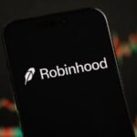 A digital dashboard showing a robinhood sees surge in bitcoin and gold prediction market activity